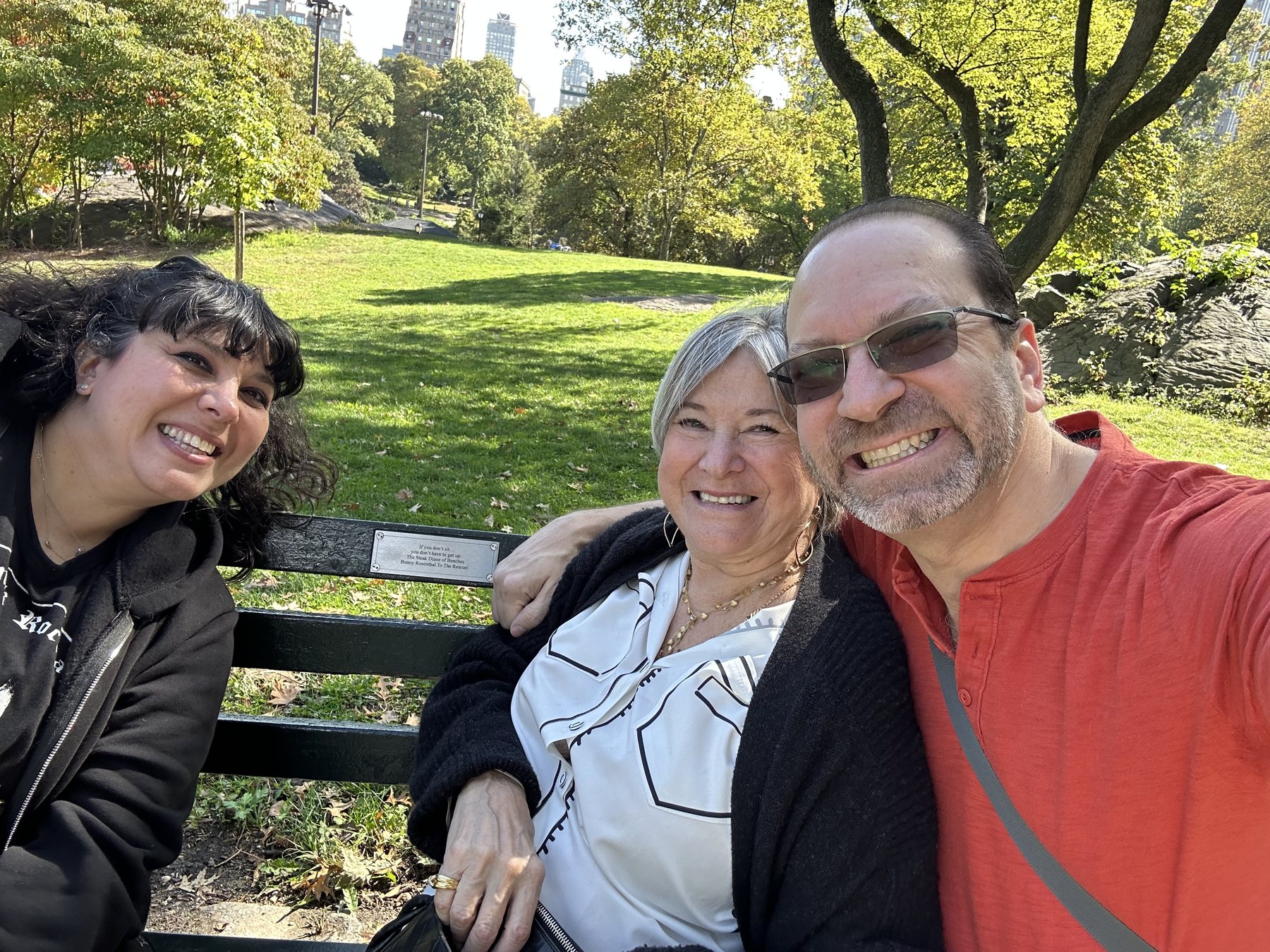 Bunny and family smiling together at the bench