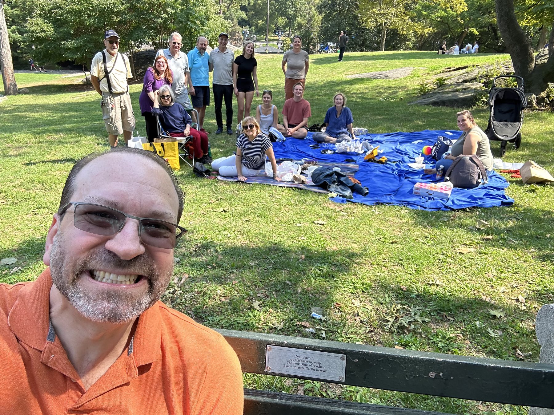 A large family picnic gathering near Bunny's bench